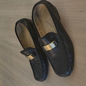 Salvatore Ferragamo Black and Gold Loafers Sleek Slip-Ons